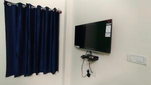 TV a/nebo společenská místnost v ubytování Green Apple Resorts