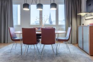 a dining room table and chairs in a room at Radisson Blu Hotel Malmö in Malmö
