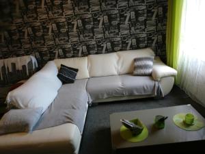 a living room with a couch and a table at Gîte de Sapiac in Montauban