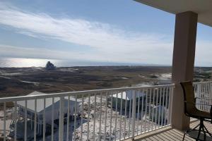 a balcony of a house with a view of the ocean at The Dunes in Gulf Shores