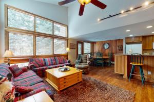 a living room with a couch and a table at Courtside 23 - Spacious East Vail Townhome in Vail