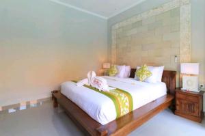 Three Brothers Bungalows & Villas客房内的一张或多张床位