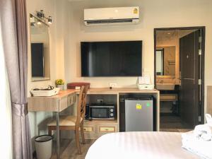 Kuchyň nebo kuchyňský kout v ubytování Hotel De Sripoom