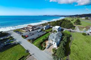 an aerial view of a house next to the ocean at Oceanview Miramar Home Steps to Beach Restaurants Trails Activities in Half Moon Bay