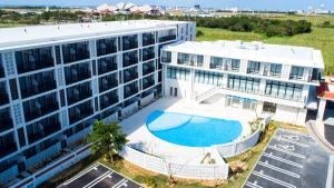 an overhead view of a building with a swimming pool at Hotel Torifito Miyakojima Resort in Miyako-jima