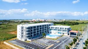 an aerial view of a building with a swimming pool at Hotel Torifito Miyakojima Resort in Miyako Island