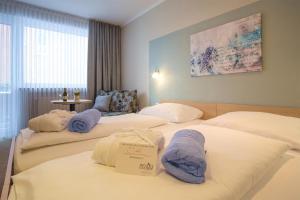 Postel nebo postele na pokoji v ubytování Hotel & Restaurant Prüser´s Gasthof
