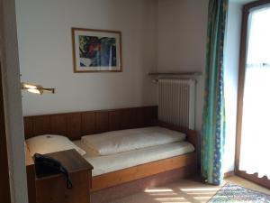 Postel nebo postele na pokoji v ubytování Hotel Neumayr