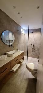 a bathroom with a sink and a toilet and a shower at Yuval holidey aprtment eilat in Eilat