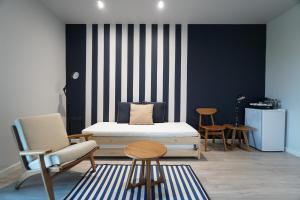 Postel nebo postele na pokoji v ubytování Blu Monkey Hub and Hotel Chanthaburi