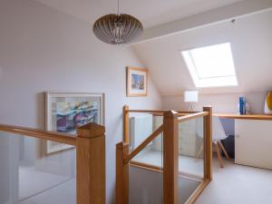 a room with a staircase and a skylight at Scarsdale in Kendal