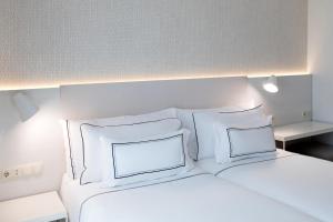 Posteľ alebo postele v izbe v ubytovaní Hotel Salamanca Montalvo