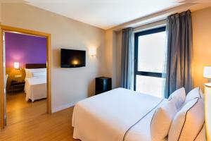 Posteľ alebo postele v izbe v ubytovaní Hotel Salamanca Montalvo