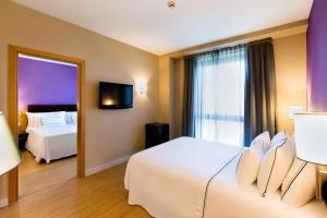 Posteľ alebo postele v izbe v ubytovaní Hotel Salamanca Montalvo