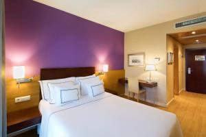 Posteľ alebo postele v izbe v ubytovaní Hotel Salamanca Montalvo