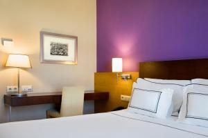 Posteľ alebo postele v izbe v ubytovaní Hotel Salamanca Montalvo