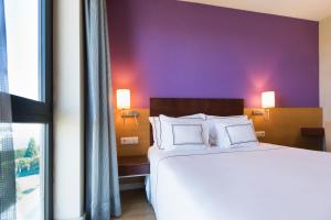 Posteľ alebo postele v izbe v ubytovaní Hotel Salamanca Montalvo