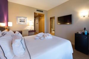 Posteľ alebo postele v izbe v ubytovaní Hotel Salamanca Montalvo