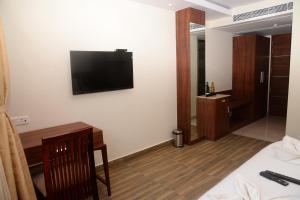TV a/nebo společenská místnost v ubytování Hotel Ami Grace