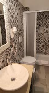 a bathroom with a sink and a toilet at Friendship Place in Rome