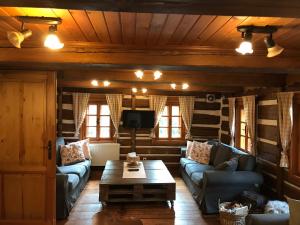 a living room with a couch and a coffee table at Chalupa U Jezu in Tanvald