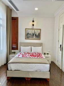 a bedroom with a bed with a red and white blanket at Nusretbey Hotel in Istanbul