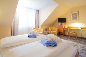 Säng eller sängar i ett rum på Hotel & Restaurant Prüser´s Gasthof