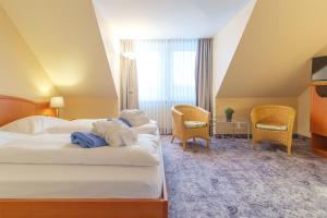 Postel nebo postele na pokoji v ubytování Hotel & Restaurant Prüser´s Gasthof