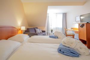 Postel nebo postele na pokoji v ubytování Hotel & Restaurant Prüser´s Gasthof