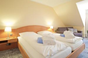 Postel nebo postele na pokoji v ubytování Hotel & Restaurant Prüser´s Gasthof