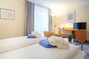 Postel nebo postele na pokoji v ubytování Hotel & Restaurant Prüser´s Gasthof