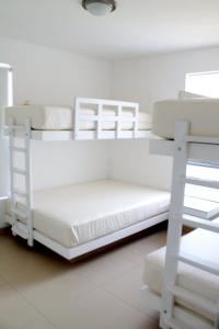 Katil dua tingkat atau katil-katil dua tingkat dalam bilik di Casa 33 Sotavento Paracas