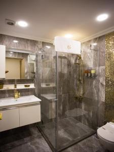 a bathroom with a shower and a toilet at Bonne Sante Hotel in Istanbul +66 photos