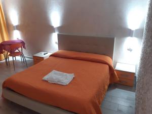 Posteľ alebo postele v izbe v ubytovaní B&B La Colonna