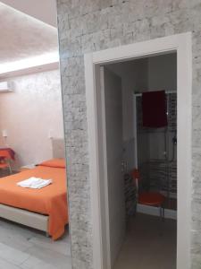 Posteľ alebo postele v izbe v ubytovaní B&B La Colonna