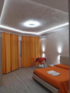 Posteľ alebo postele v izbe v ubytovaní B&B La Colonna