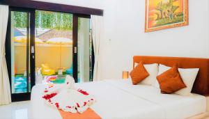 Postel nebo postele na pokoji v ubytování Bahana Guest House + 37 fotografií
