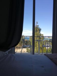 
a view from a window of a room with a balcony at Miramare Hotel in Athens

