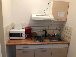Kuchyň nebo kuchyňský kout v ubytování Apartmenthaus Home24