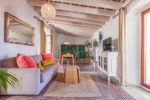 a living room with a couch and a table at Ático Al Andalus in Tarifa