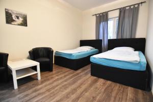 Ένα ή περισσότερα κρεβάτια σε δωμάτιο στο City Apartment am Hildeboldplatz