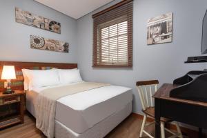 Postel nebo postele na pokoji v ubytování Hotel Pousada Pacaembu