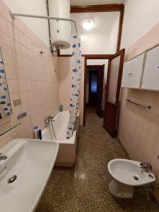 a bathroom with a sink and a tub and a toilet at Holiday in Portofino by PortofinoVacanze in Rapallo