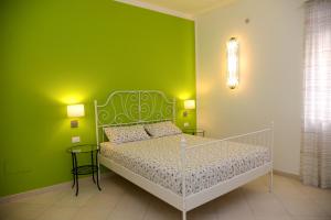 Postel nebo postele na pokoji v ubytování Jonico Guest House