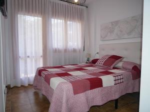 Ein Bett oder Betten in einem Zimmer der Unterkunft Principat-Vacances Pirinenca