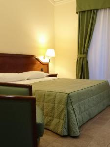 
Letto o letti in una camera di Hotel Villa Peretti
