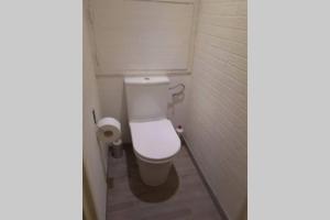 a bathroom with a white toilet in a stall at Vu sur les Constellations . in Grenoble