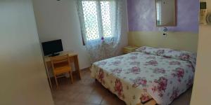 Posteľ alebo postele v izbe v ubytovaní Agriturismo La Fraterna