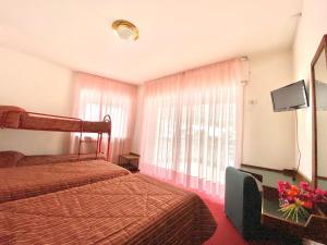 Voodi või voodid majutusasutuse Park Hotel Bozzi toas