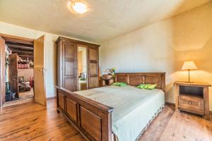 a bedroom with a bed and a table with a lamp at Holiday House Eleonora in Barban +27 photos